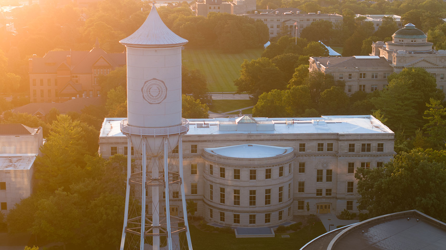 drone view of sunrise over campus