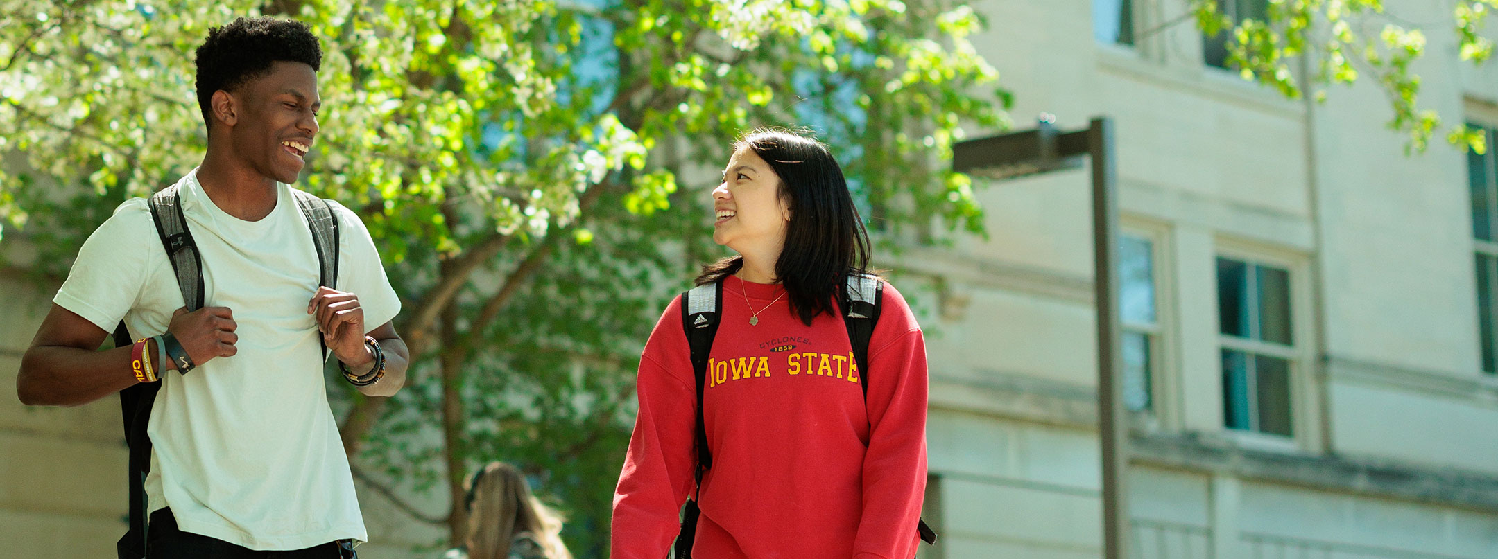 two students walking together outside of Marston HJall