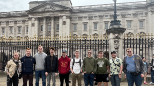 ISu Engineering Study Abroad student group stands outside Buckingham Palace in London